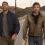 Aaron Pierre and Kyle Chandler walking on the road toward the camera - Lanterns First Look Image - Courtesy of HBO