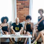 Terry Milla and FreeQuincy Girls On Couch Serious - press photo